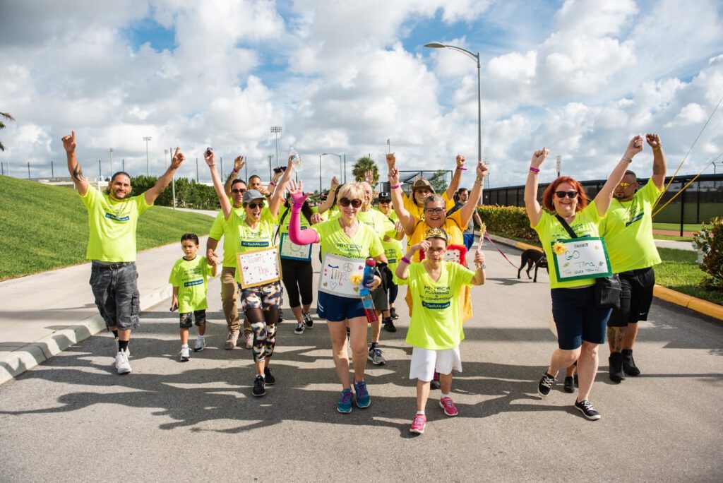 Best Buddies walking and cheering