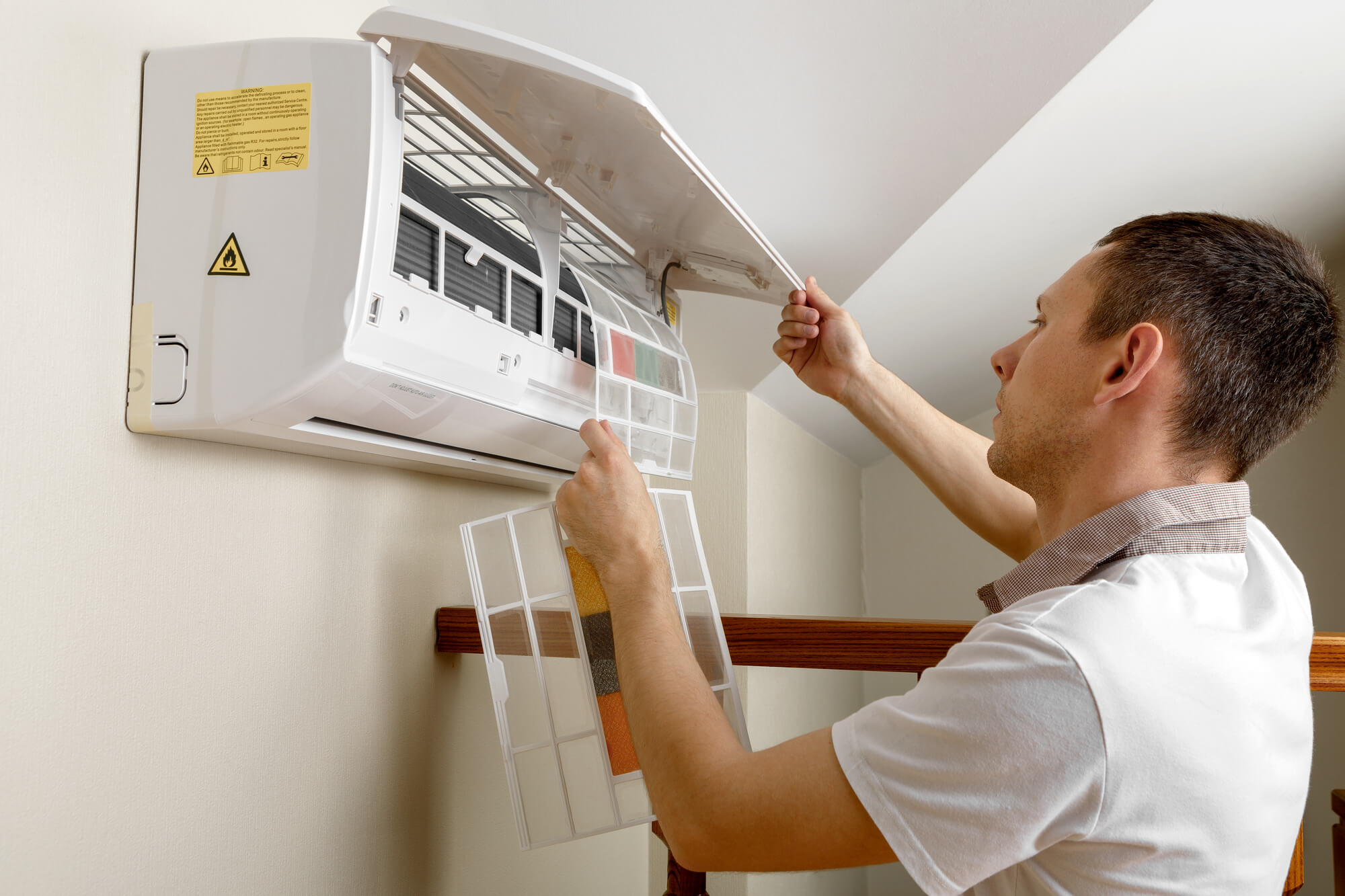 expert fixing an AC unit